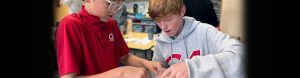 students work on science lab project